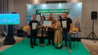 Gojek Hadirkan Mobil Listrik di Bandara YIA, Fitur Aplikasinya Dukung Wisata Lokal
