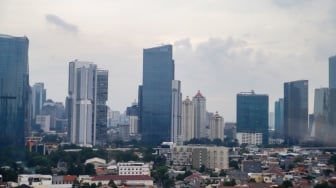 Suasana perumahan dan gedung bertingkat di Jakarta, Rabu (15/1/2025). [Suara.com/Alfian Winanto]