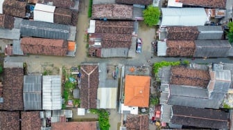 Foto udara banjir merendam Desa Tempel, Krian, Sidoarjo, Jawa Timur, Kamis (27/2/2025). [ANTARA FOTO/Umarul Faruq/nym]