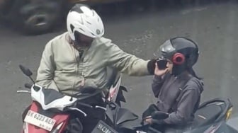 Bikin Malu! Personel Polantas di Medan Terekam Pungli Pengendara Motor Rp 100 Ribu