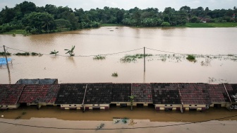 Foto udara kawasan permukiman yang terendam banjir di Perumahan Taman Cikande, Jayanti, Kabupaten Tangerang, Banten, Rabu (14/1/2026). [ANTARA FOTO/Putra M. Akbar/foc]
