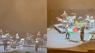 Personel Band Massive Attack Dicekal Singapura Usai Kibarkan Bendera Palestina saat Konser