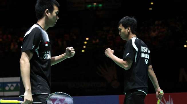 Pasangan Mohamad Ahsan (kanan)/Hendra Setiawan di ajang All England 2014, Minggu (9/3). [Humas PBSI]