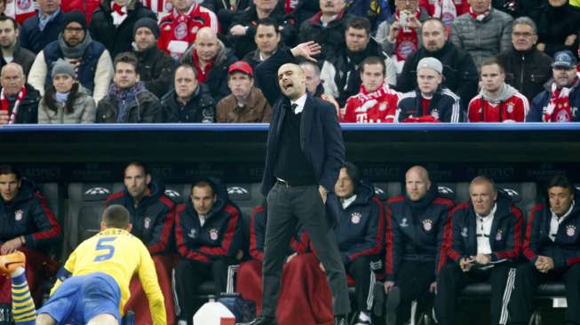 Bayern Munich lolos ke perempat final Liga Champions usai menahan imbang Arsenal 1-1 di Allianz Arena, Rabu (12/3). Bayern menang dengan agregat 3-1. [Reuters/Kai Pfaffenbach]