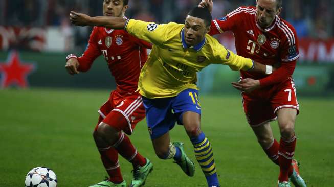 Bayern Munich lolos ke perempat final Liga Champions usai menahan imbang Arsenal 1-1 di Allianz Arena, Rabu (12/3). Bayern menang dengan agregat 3-1. [Reuters/Kai Pfaffenbach]