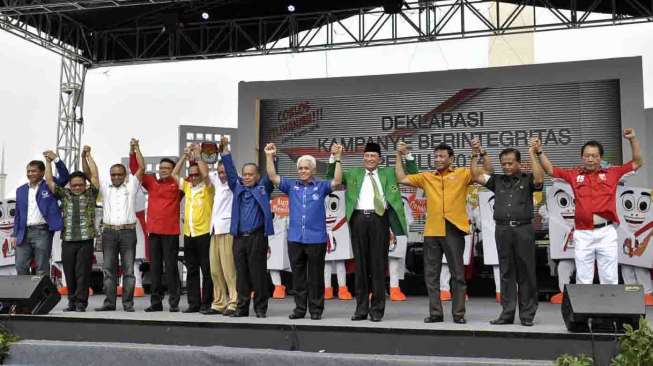 Deklarasi dan Pawai Kampanye Berintegritas Pemilu 2014 yang di lapangan Monumen Nasional Jakarta, Sabtu (15/3). [suara.com/Adrian Mahakam]