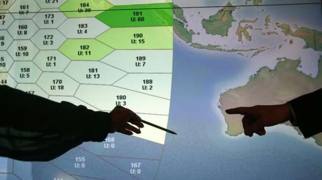 Suasana ruang kerja Inmarsat, yang menyatakan perjalanan pesawat Malaysia Airlines MH370 berakhir, di London, Selasa (25/3) [Reuters/Andrew Winning]