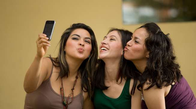 Ilustrasi: tes kepribadian lewat ekspresi wajah saat selfie atau swafoto. (Shutterstock/Glenn R Specht)