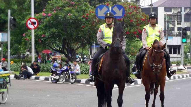 Pengamanan Peringatan Hari Buruh Internasional atau May Day di depan Istana Merdeka Jakarta, Kamis (1/5). [suara.com/Bagus Santosa]