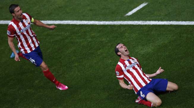 Diego Godin merayakan golnya ke gawang Real Madrid [Reuters/Paul Hanna]