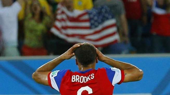 John Brooks usai mencetak gol dalam pertandingan antara Amerika Serikat dengan Ghana di Dunas arena, di Natal, Minggu (16/6). [Reutres/Brian Snyder]