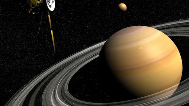 Saturnus, Titan, dan wahana antariksa Cassini (NASA/Shutterstock).