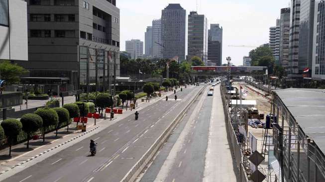 Suasana lengang pada hari pencoblosan pilpres di sekitar Jalan Sudirman - Thamrin Jakarta, Rabu (9/7). [suara.com/Adrian Mahakam]