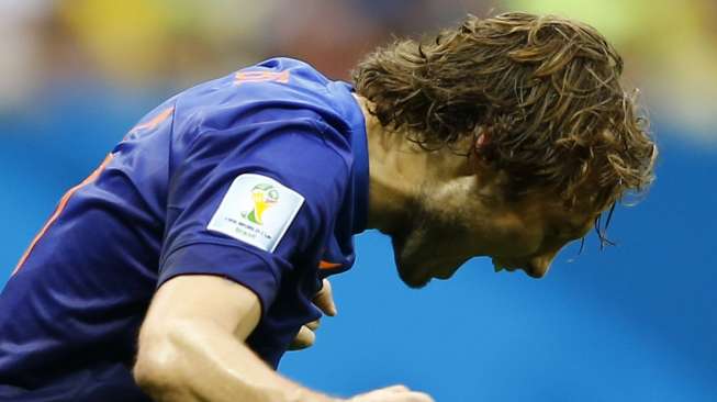 Pemain Belanda Daley Blind merayakan gol kedua Belanda ke gawang Brasil dalam perebutan juara tiga Piala Dunia di Brasilia,(13/7). (Reuters/Dominic Ebenbichler)