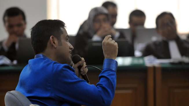 Mantan Bendahara Umum Partai Demokrat M. Nazaruddin menjadi saksi dalam persidangan dengan terdakwa Anas Urbaningrum di Pengadilan Tipikor Jakarta, Senin (25/8). [suara.com/Adrian Mahakam]