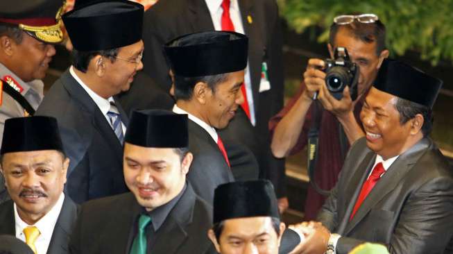 Gubernur DKI Jakarta Joko Widodo dan Wakil Gubernur Basuki Tjahja Purnama menghadiri pelantikan anggota DPRD DKI Jakarta, Senin (25/8). [suara.com/Kurniawan Mas'ud]