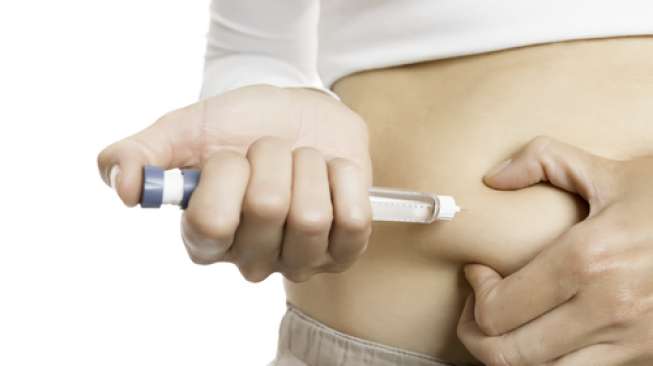 Ilustrasi suntik insulin. (Shutterstock)