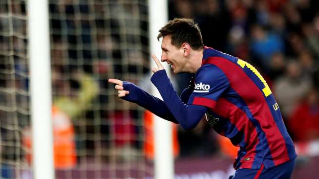 Lionel Messi rayakan golnya ke gawang Espanyol  [Reuters/Gustau Nacarino]