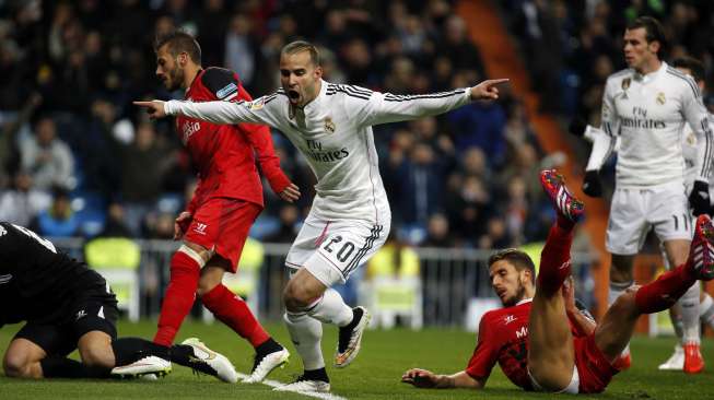 Pemain Real Madrid Jese Rodriguez merayakan golnya ke gawang Sevilla. REUTERS/Susana Vera