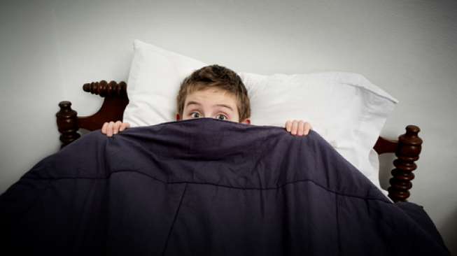 Ilustrasi anak yang mengalami mimpi buruk. (Shutterstock)