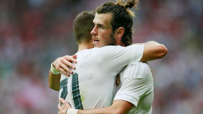 Pemain Real Madrid Gareth Bale merayakan golnya ke gawang Tottenham Hotspur. Reuters / Jason Cairnduff Livepic