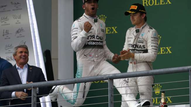 Lewis Hamilton, pebalap dari tim Mercedes, merebut gelar juara dunia Formula Satu musim ini usai menjadi yang tercepat dalam seri balapan Grand Prix di Sirkuit The Americas, Austin, Texas, Amerika Serikat, (25/10).[Reuters]