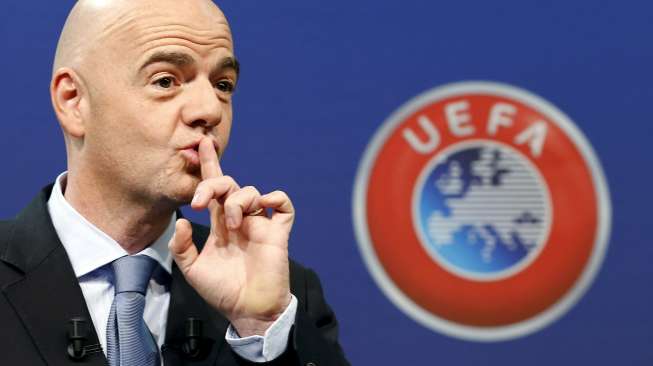 UEFA General Secretary Gianni Infantino asks the audience for silence before the draw for the play-off matches for UEFA Euro 2016 at the UEFA headquarters in Nyon, Switzerland, October 18, 2015.