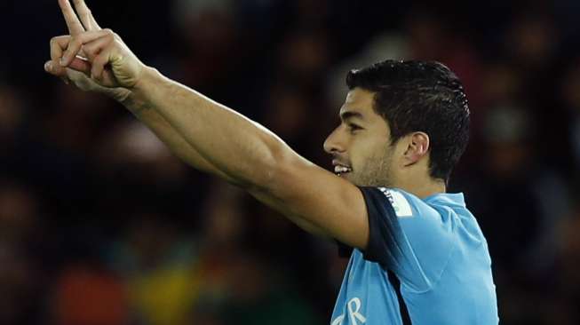 Luis Suarez rayakan golnya ke gawang Guangzhou Evergrande (17/12) [Reuters/Toru Hanai]