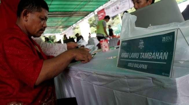 Bank Negara Indonesia (BNI) membuka pendaftaran mudik gratis di Parkir Timur Senayan, Jakarta, Rabu (29/6).[Suara.com/Oke Atmaja]