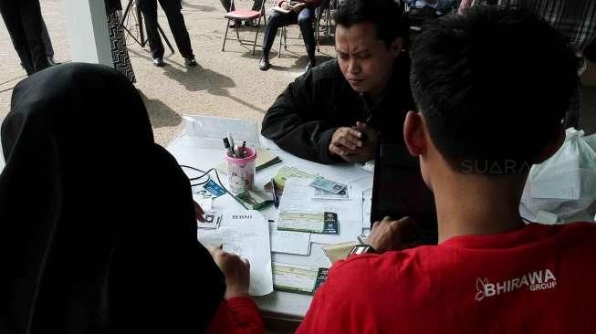 Bank Negara Indonesia (BNI) membuka pendaftaran mudik gratis di Parkir Timur Senayan, Jakarta, Rabu (29/6).[Suara.com/Oke Atmaja]