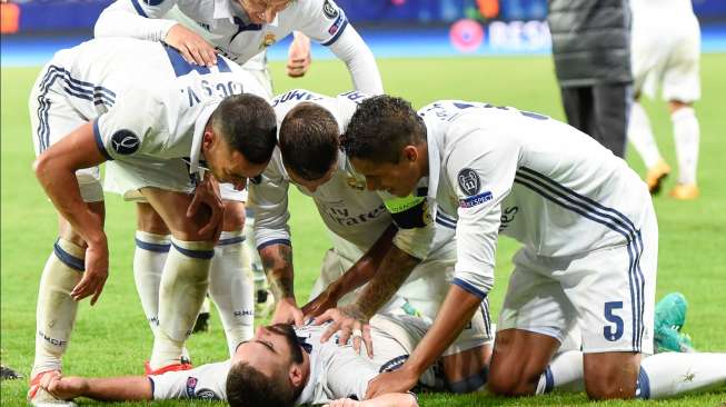 Perayaan gol Daniel Carvajal bersama rekannya di Real Madrid, saat mengalahkan Sevilla di Piala Super Eropa, Selasa (9/8/2016), di Trondheim, Norwegia. [Jonathan Nackstrand/AFP]