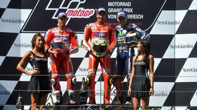 Andrea Iannone, Andrea Dovizioso, dan Jorge Lorenzo di podium Red Bull Ring, Austria, (14/8). (AFP)