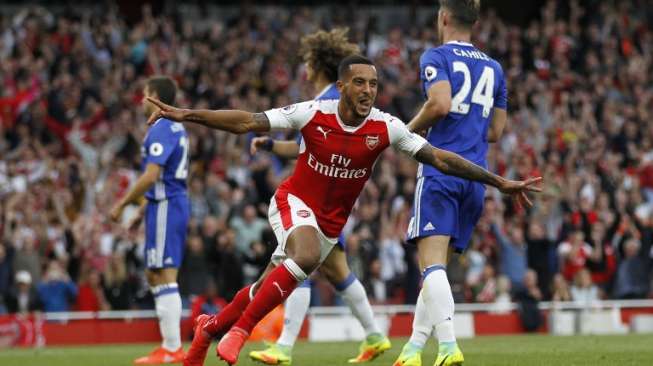 Gelandang Arsenal Theo Walcott merayakan golnya ke gawang Chelsea. Ian Kington / IKIMAGES / AFP