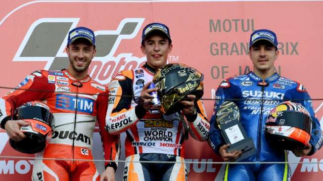 Marc Marquez mengamankan gelar juara dunia ketiganya usai memenangi seri balap MotoGP di Sirkuit Motegi, Jepang, Minggu (16/10/2016). Sementara itu, Valentino Rossi gagal finis setelah terjatuh di pertengahan lomba. (AFP)