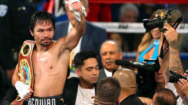 Manny Pacquiao berhasil kalahkan Jessie Vargas.