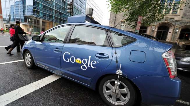 Ilustrasi mobil dengan logo Google (AFP/Karen Bleier).