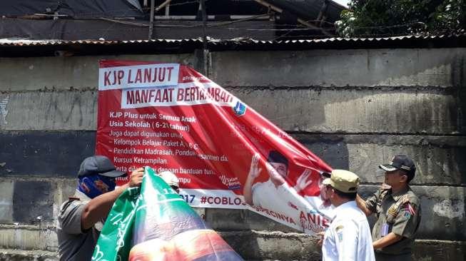 Polisi Kantongi Nama Otak Spanduk Tolak Jasad Pro Ahok