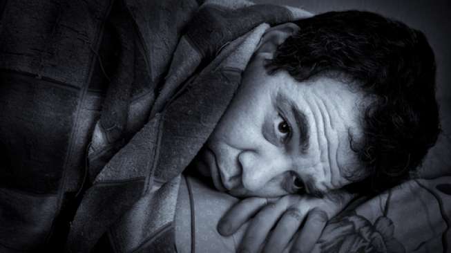 Ilustrasi lelaki yang mengalami insomnia. (Shutterstock)