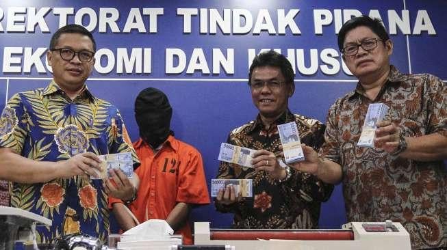 Tindak Pidana Ekonomi dan Khusus Bareskrim Polri merilis peredaran uang palsu di, Jakarta, Jumat (16/6).