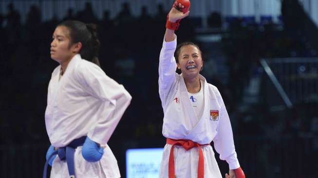 Dengan skor 6-0 atas karateka putri Thailand. 