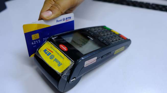 OJK Desak Perbankan Percepat Migrasi Kartu ATM Magnetic ke Chip