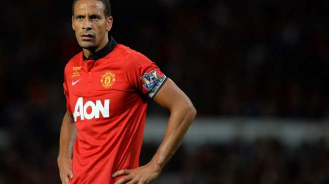 Rio Ferdinand saat masih berseragam Manchester United. [AFP/Andrew Yates]