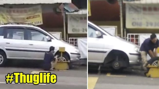 Viral! Perjuangan Lelaki Bongkar Ban Mobil yang Digembok Petugas