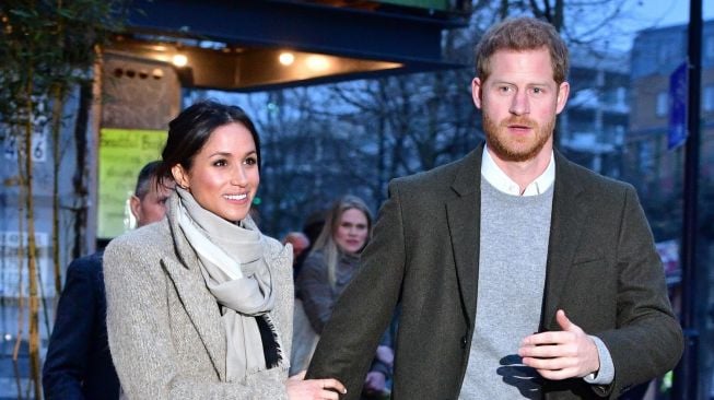 Pangeran Harry dan Meghan Markle. [AFP/Dominic Lipinski]