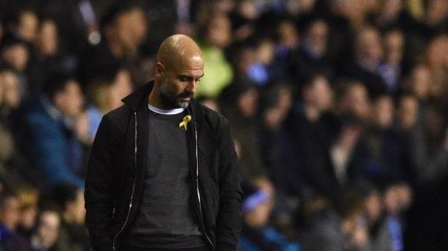 Manajer Manchester City Pep Guardiola. Oli SCARFF / AFP