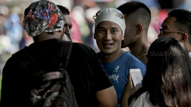 Menteri Susi Pudjiastuti dan Wagub DKI Jakarta Sandiaga Uno berduel di Festival Danau Sunter, Minggu (25/2/2018). 