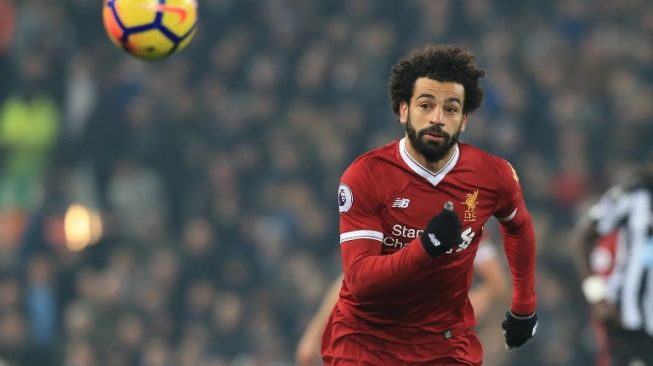 Striker Liverpool asal Mesir, Mohamad Salah beraksi di laga kontra Newcastle United, Sabtu malam (3/3). [AFP/Lindsey Parnaby]