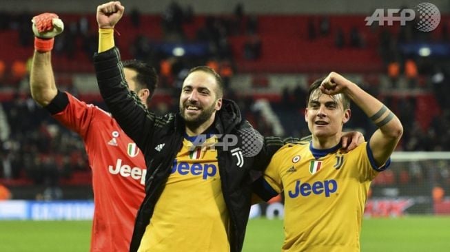 Para pemain Juventus merayakan kemenangan atas Tottenham Hostpur. (Glyn Kirk / AFP)