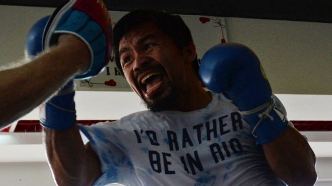 Petinju Filipina, Manny Pacquiao tengah berlatih. [AFP/Ted Aljibe]