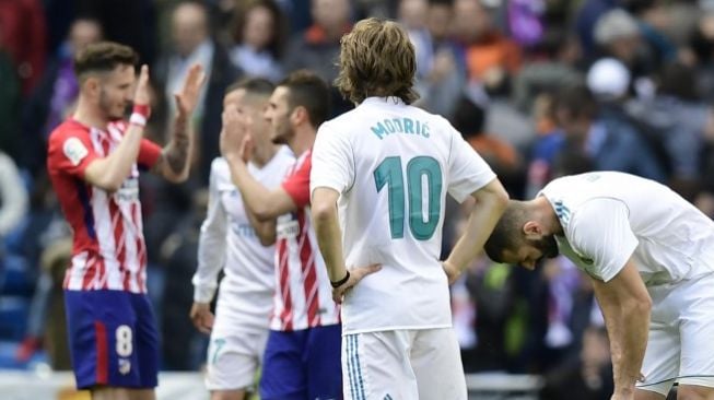 Reaksi pemain Real Madrid Luka Modric setelah Atletico menyeimbangkan papan skor [AFP]